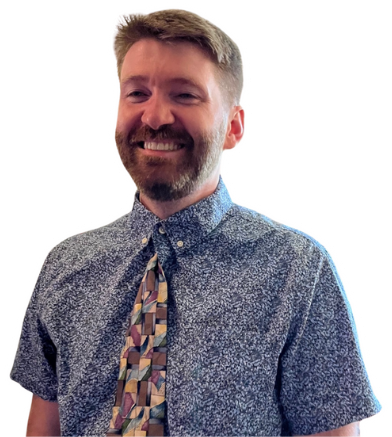 Peter Boone posing against a blue background.