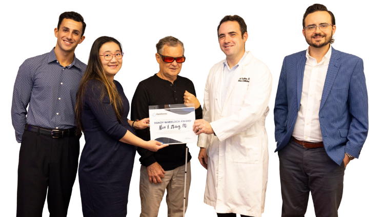 Neal Bench, CRF President, awarding Alice Zhang, MD and colleagues the 2025 Randy Wheelock Award at UNC-Chapel Hill.