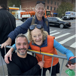 Todd Beckett posing with two family members during the TCS New York City Marathon.